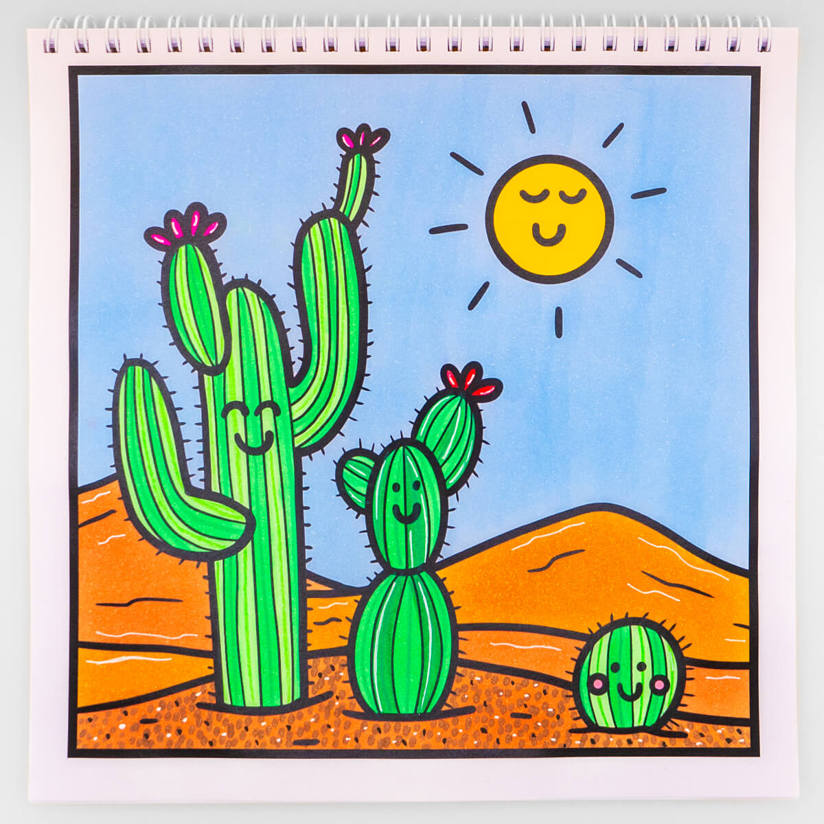 Desert-themed cactus sunset colouring page featuring smiling cacti under a sunny sky, ideal for relaxing creativity.